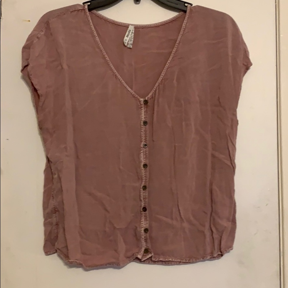 Woman’s blush top.
